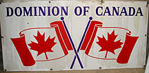 one%20large%20steel%20tile%20with%20two%20Canadian%20flags%20crossed%20and%20%22Dominion%20of%20Canada%22%20across%20the%20top%20marking%20the%20border%20in%20the%20Windsor-Detroit%20tunnel